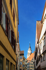 View of Stiftskirche Tower through a Narrow Street in Tubingen Old Town