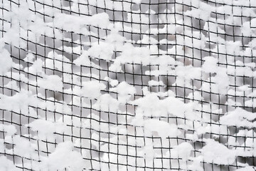 ネットに付着した雪の模様