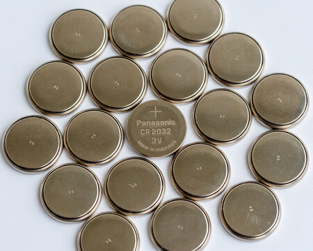 Many CR2032 Panasonic Coin Cell Batteries Grouped Together