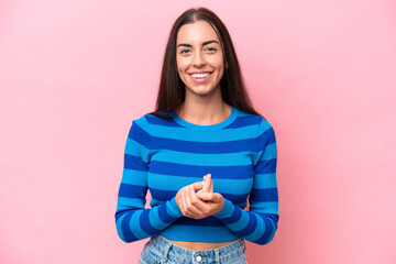 Obraz premium Young caucasian woman isolated on pink background laughing