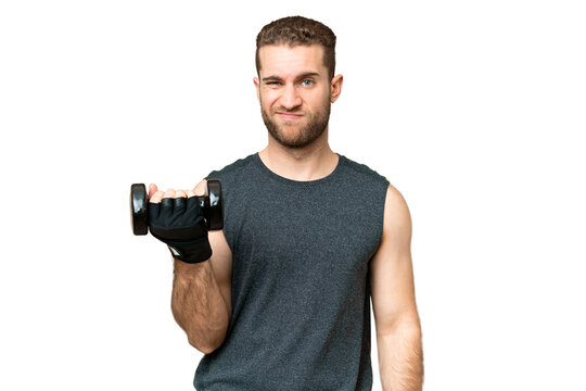 Young sport man making weightlifting over isolated chroma key background with sad expression