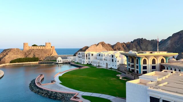 View from Mutrah beach in Muscat showing Al Jalali Fort, Al Alam Palace and historic landmarks by the sea.