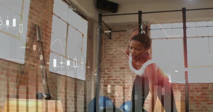 Woman hinging waist, reaching and shifting weight, warming up in studio, finance charts overlaying