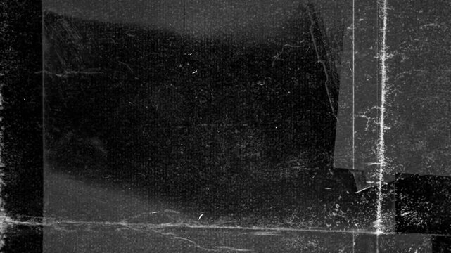 Illustrated with textures featuring black and gray streaks and white spots. It has a grunge, dirt-like style.