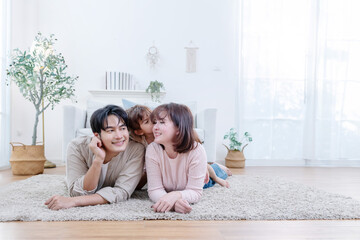 Asian family enjoys spending their time together in a living room