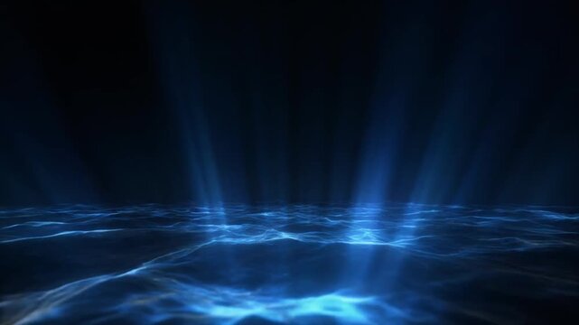 A beam of light shining through dark ocean water with waves
