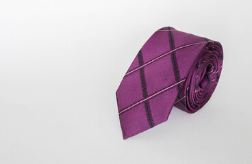 Elegant Purple Men&rsquo;s Necktie on White Background with Copy Space.