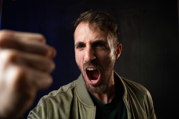 Frustrated man screaming expressing anger and aggression