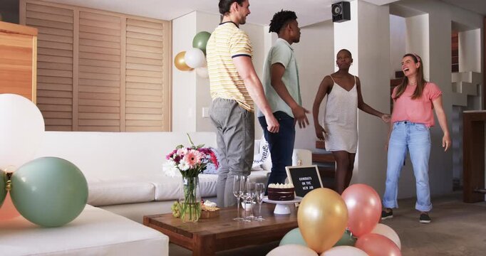 At party, Friends celebrating at home, exchanging gifts and enjoying festive atmosphere