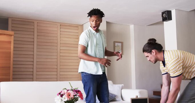 At party, Friends celebrating new job at home with balloons and flowers, feeling joyful