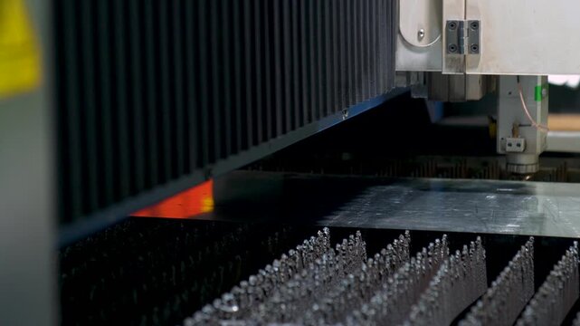 Close Up Shot Of A Plasma Cutter CNC Machine Cutting Steel Sheet Metal During Fabrication Process.