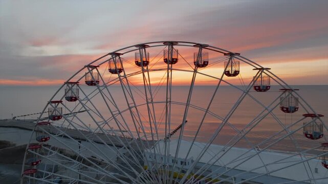 Ferris wheel at sunrise in Ocean City New Jersey boardwalk aerial