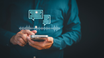 Person using smartphone with voice recognition and AI chatbot messaging technology. Digital...