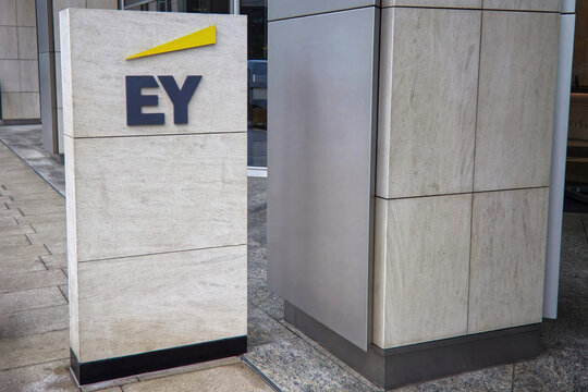 EY Ernst and Young logo or sign. Ernst and Young is a global professional services firm providing audit, assurance, consulting, tax, and advisory services.