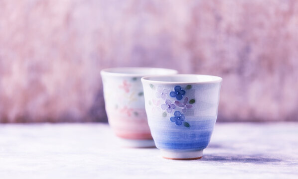 Traditional japanese ceramic on rustic wooden background. Soft focus. Copy space.