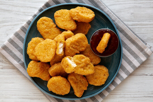 Chicken Nuggets with Sweet Chili Sauce on a Plate, top view.