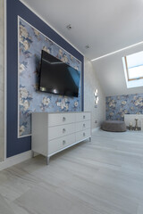 Fototapeta premium Modern Bedroom Entertainment Area with Wall Mounted TV and Dresser