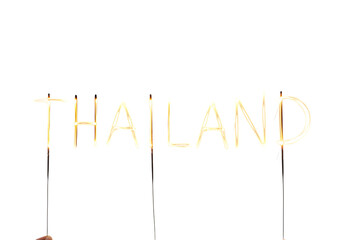 Thailand Sign Made with Sparklers on White.
