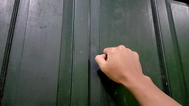 knocking on the door in a hurry. The concept of knocking on the door