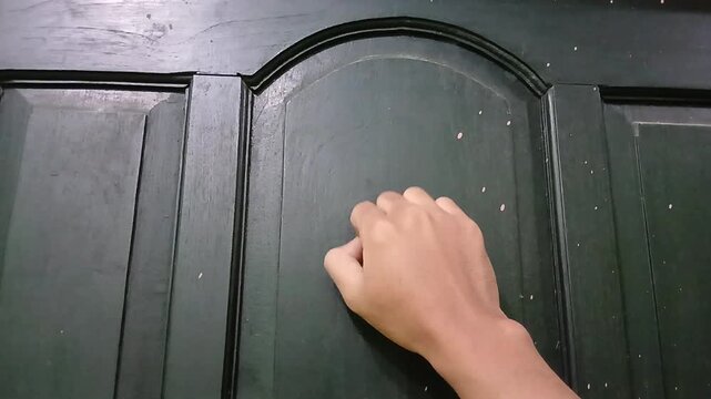 knocking on the door in a hurry. The concept of knocking on the door