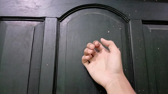 knocking on the door in a hurry. The concept of knocking on the door