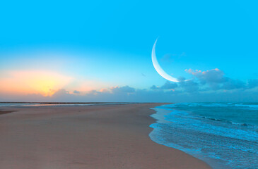 Ramadan Kareem background - Abstract background of amazing crescent moon over the sea at sunset