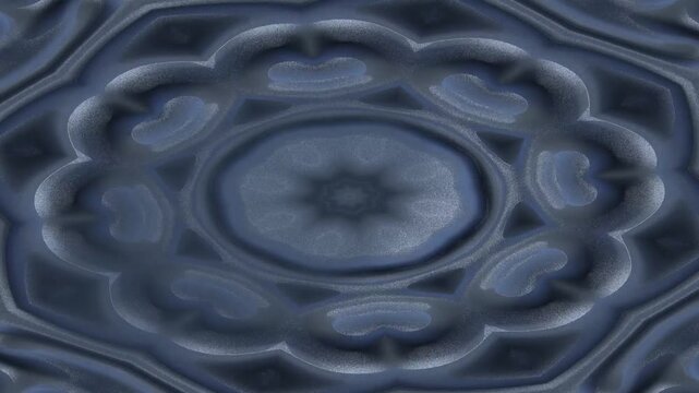 Abstract symmetrical pattern with cool blue and grey tones, resembling a stylized flower or ripple effect.