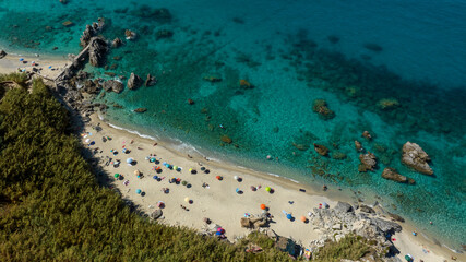 Obraz premium Aerial view of Michelino Beach, located near Tropea, in province of Vibo Valentia, Calabria, southern Italy. This beautiful coastline overlooking the Tyrrhenian Sea is known as the Coast of the Gods.