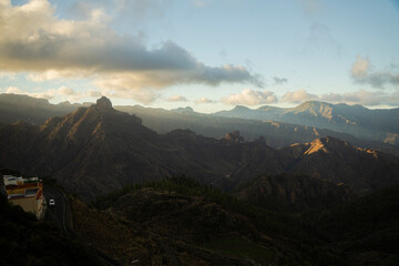 Wide mountain landscape at sunset with layered ridges © Stoca