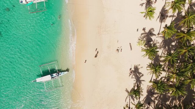Turquoise water and white sand shoreline at Seven Commandos Beach Palawan