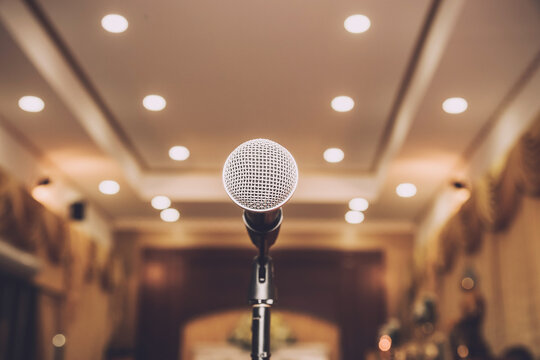 Microphone on abstract blurred in seminar room or speaking conference hall, Event Background