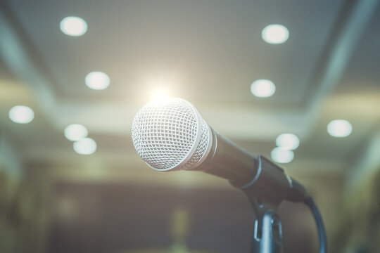Microphone on abstract blurred in seminar room or speaking conference hall, Event Background