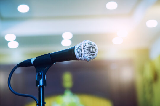 Microphone on abstract blurred in seminar room or speaking conference hall, Event Background