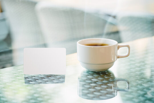 mock up of credit card put near coffee cup