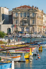 Fototapeta premium Colorful boats and historic waterfront architecture in Sete France