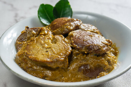 Rendang Jengkol, a traditional Indonesian dish made from jengkol beans (Archidendron jiringa). The dish is known for its strong, distinctive aroma and flavor. Selective focus
