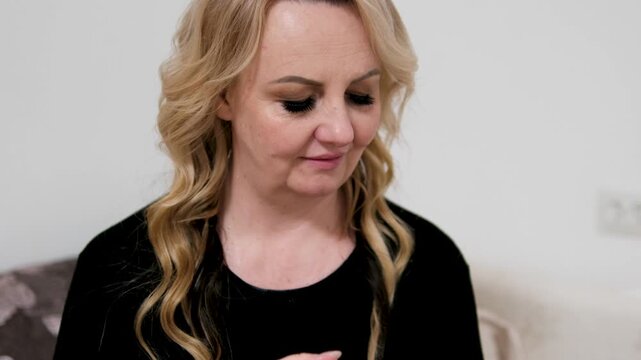 Blonde woman neck mature lady touching her neck and shoulders. Graceful female embracing her natural beauty and positive aging. 4k high res