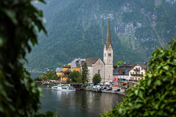 Hallstatt village with church and lake in the Austrian Alps in summer