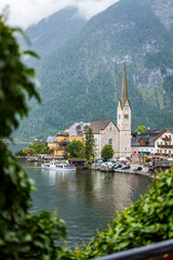 Hallstatt village with church and lake in the Austrian Alps in summer
