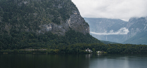 Alpine mountain landscape with lake near Hallstatt in Austria on a cloudy summer day