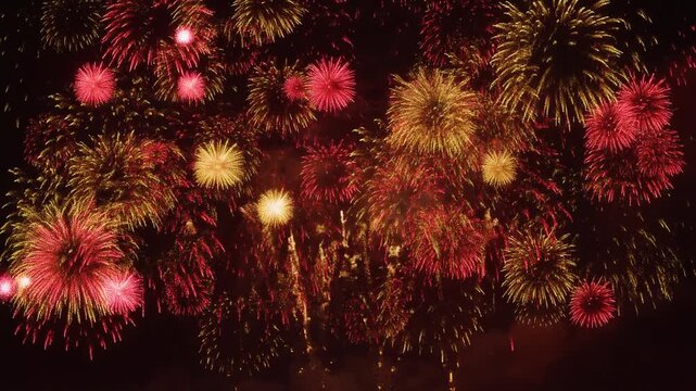 Fireworks explosion over festive celebration, vibrant colors, dynamic lights, dramatic display, cultural event, nighttime spectacle video footage