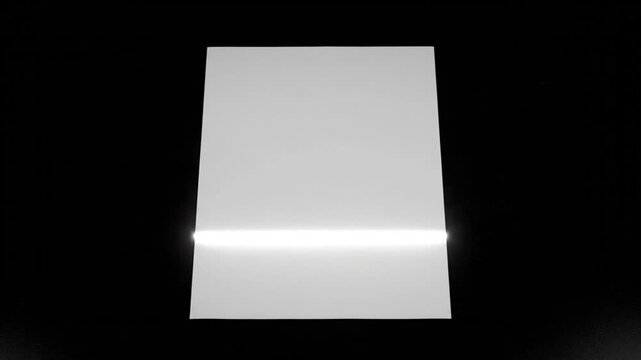 A brilliant white horizontal light line slowly glides down the surface of a stark white, trapezoidal screen against a pure black background, creating a mesmerizing, minimalist graphic animation over 