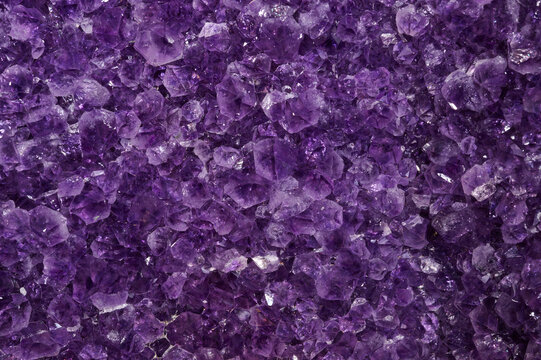 Closeup of a raw Amethyst purple rock with incredible details and resolution.