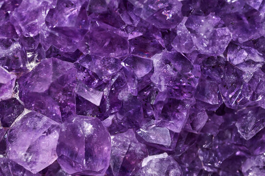 Closeup of a raw Amethyst purple rock with incredible details and resolution.