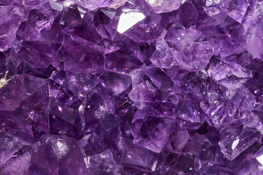 Closeup of a raw Amethyst purple rock with incredible details and resolution.