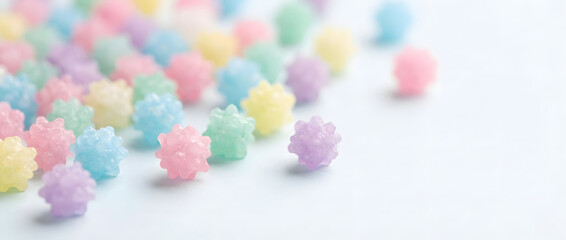 Colorful pastel Konpeito Japanese star candy scattered on a clean white background.