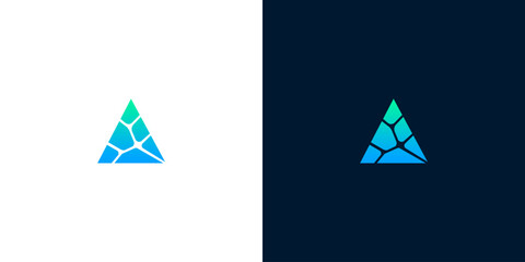 A modern and abstract triangular logo design featuring interconnected blue and green geometric fragments, symbolizing growth, innovation, and digital structure for technology and business branding