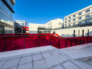 Striking Modern Architecture Featuring Bold Red Glass Elements in Urban Setting