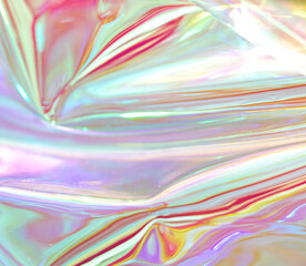 Iridescent holographic foil texture with pastel colors and flowing light for abstract background