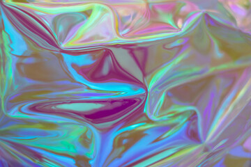 Fototapeta premium Iridescent holographic texture with colorful, reflective waves and dreamlike light for artistic projects